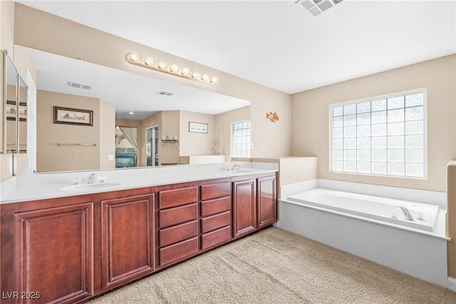 1141 Brent Park Ct, Henderson, NV 89002 - bathroom with double vanity, a garden tub, and carpet floors