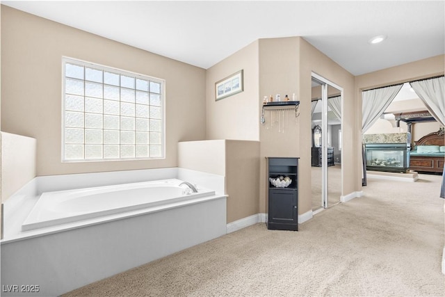 1141 Brent Park Ct, Henderson, NV 89002 - bathroom featuring a garden tub and carpet