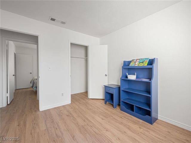 2214 Pebble Creek Ln, Laughlin, NV 89029 - bedroom with light wood-style floors and a closet