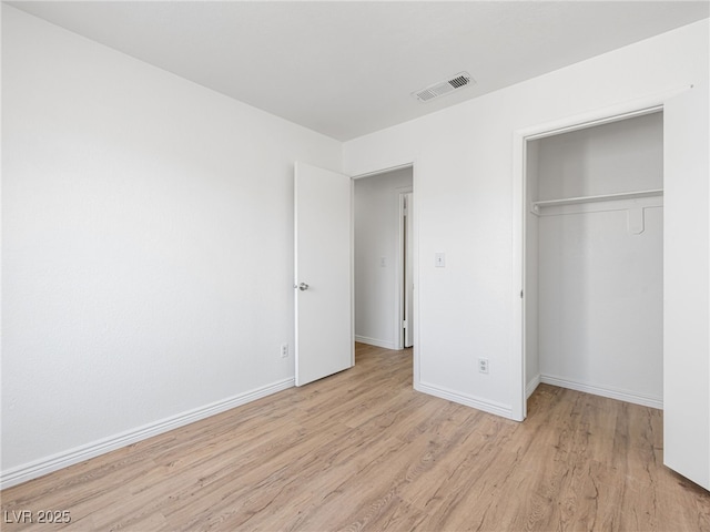 2214 Pebble Creek Ln, Laughlin, NV 89029 - unfurnished bedroom featuring light wood-style flooring and a closet
