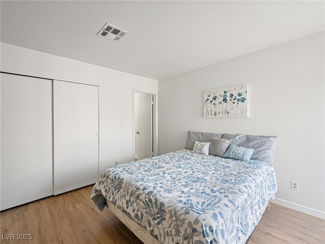 2214 Pebble Creek Ln, Laughlin, NV 89029 - bedroom featuring wood finished floors and a closet