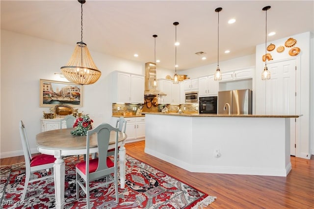 7209 Millerbird St, North Las Vegas, NV 89084 - dining room featuring light wood-style floors, a chandelier, and recessed lighting