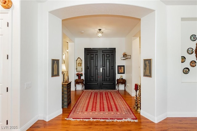 7209 Millerbird St, North Las Vegas, NV 89084 - entrance foyer featuring arched walkways and wood finished floors