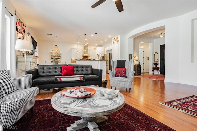 7209 Millerbird St, North Las Vegas, NV 89084 - living area with wood finished floors, arched walkways, a ceiling fan, and recessed lighting