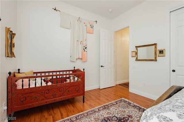 7209 Millerbird St, North Las Vegas, NV 89084 - bedroom with wood finished floors and baseboards