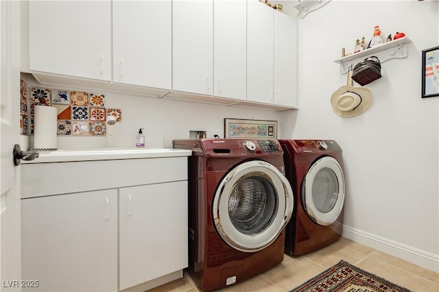 7209 Millerbird St, North Las Vegas, NV 89084 - laundry room featuring separate washer and dryer, cabinet space, and light tile patterned floors
