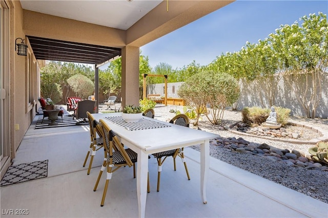 7209 Millerbird St, North Las Vegas, NV 89084 - fenced backyard featuring outdoor dining space and a patio area