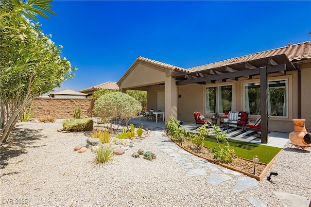 7209 Millerbird St, North Las Vegas, NV 89084 - back of property featuring stucco siding, a tile roof, and a patio area