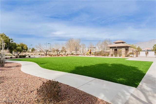 7209 Millerbird St, North Las Vegas, NV 89084 - view of property's community featuring a gazebo and a mountain view