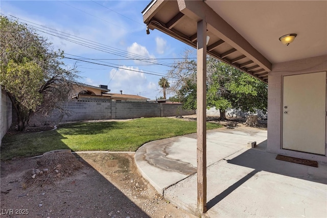 1037 Westminster Ave, Las Vegas, NV 89119 - fenced backyard with a patio area