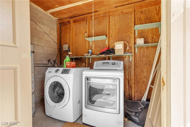 1037 Westminster Ave, Las Vegas, NV 89119 - laundry area featuring independent washer and dryer, concrete block wall, and water heater