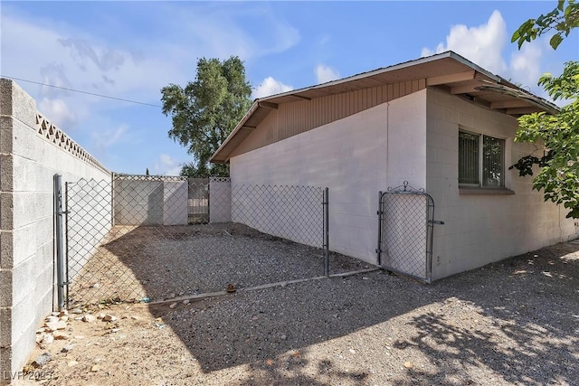 1037 Westminster Ave, Las Vegas, NV 89119 - view of side of property with concrete block siding and a gate