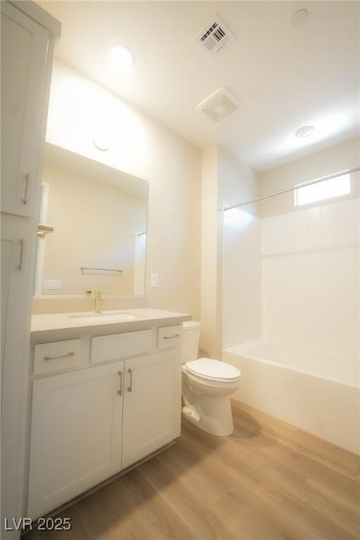 4182 Solace St, Las Vegas, NV 89135 - bathroom with vanity, wood finished floors, and bathtub / shower combination