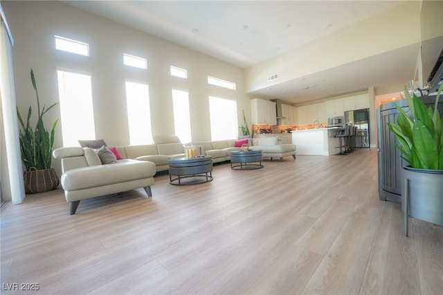 4182 Solace St, Las Vegas, NV 89135 - living room featuring light wood-type flooring