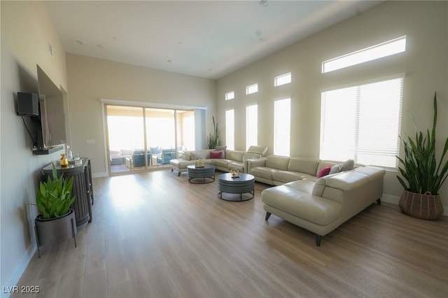 4182 Solace St, Las Vegas, NV 89135 - living area featuring light wood-type flooring and baseboards