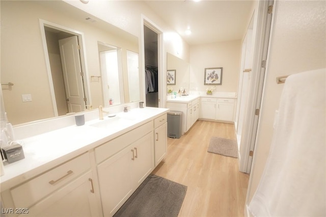 4182 Solace St, Las Vegas, NV 89135 - full bathroom featuring wood finished floors, vanity, and a spacious closet