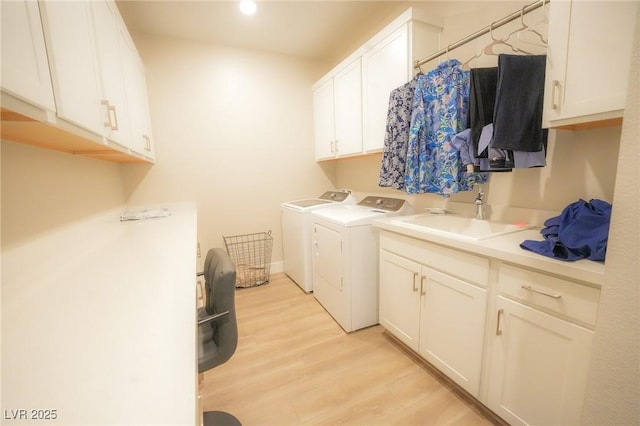 4182 Solace St, Las Vegas, NV 89135 - laundry room featuring washer and dryer, cabinet space, and light wood-style flooring