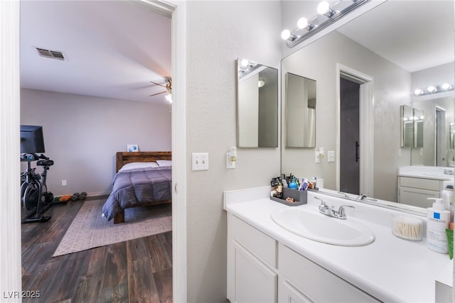 5243 Edna Crane Ave, North Las Vegas, NV 89031 - bathroom featuring wood finished floors, ceiling fan, and vanity