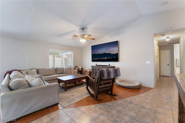 5243 Edna Crane Ave, North Las Vegas, NV 89031 - living area featuring vaulted ceiling, a ceiling fan, and light tile patterned floors