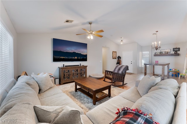 5243 Edna Crane Ave, North Las Vegas, NV 89031 - living room featuring a chandelier, lofted ceiling, and ceiling fan