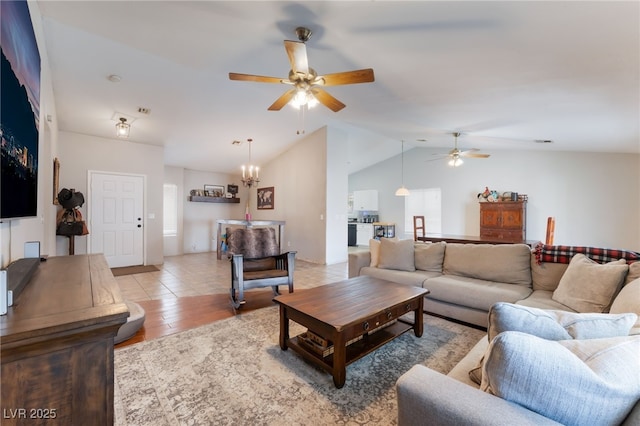 5243 Edna Crane Ave, North Las Vegas, NV 89031 - living area featuring a ceiling fan, vaulted ceiling, light wood-style floors, and a chandelier
