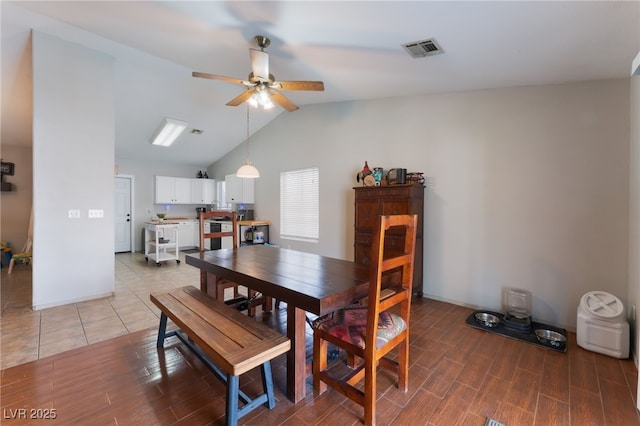 5243 Edna Crane Ave, North Las Vegas, NV 89031 - dining area featuring a ceiling fan, vaulted ceiling, and light wood-type flooring
