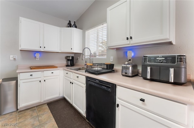 5243 Edna Crane Ave, North Las Vegas, NV 89031 - kitchen with black dishwasher, white cabinetry, and light countertops