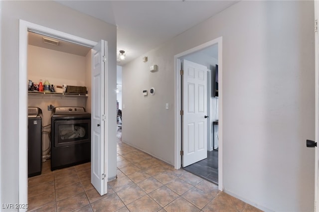 5243 Edna Crane Ave, North Las Vegas, NV 89031 - hall with separate washer and dryer and tile patterned floors