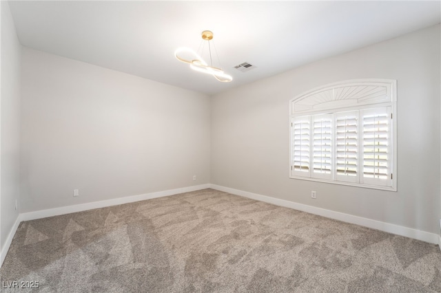 1016 Eaglewood Dr, Las Vegas, NV 89144 - carpeted empty room with baseboards and a chandelier
