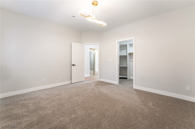 1016 Eaglewood Dr, Las Vegas, NV 89144 - carpeted spare room with baseboards and a chandelier