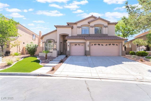 1016 Eaglewood Dr, Las Vegas, NV 89144 - mediterranean / spanish home featuring an attached garage, stucco siding, a tiled roof, and driveway