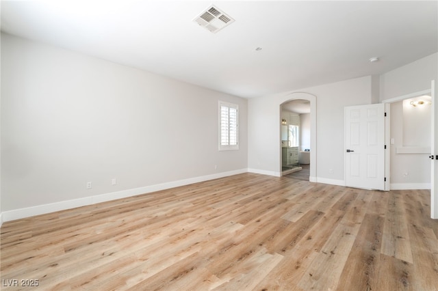 1016 Eaglewood Dr, Las Vegas, NV 89144 - spare room with arched walkways and light wood-type flooring