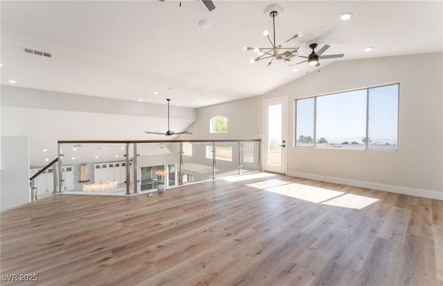1016 Eaglewood Dr, Las Vegas, NV 89144 - unfurnished living room with ceiling fan, lofted ceiling, a chandelier, light wood-style flooring, and recessed lighting