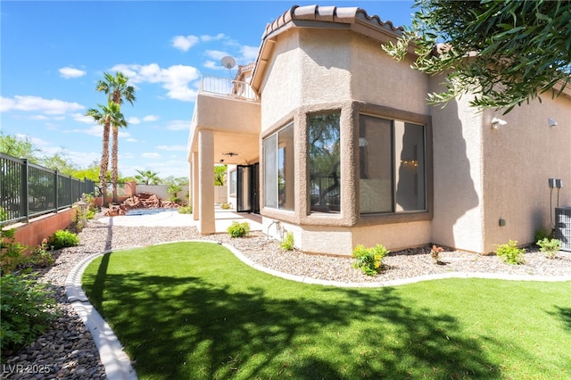 1016 Eaglewood Dr, Las Vegas, NV 89144 - back of house featuring stucco siding, a fenced backyard, and a patio