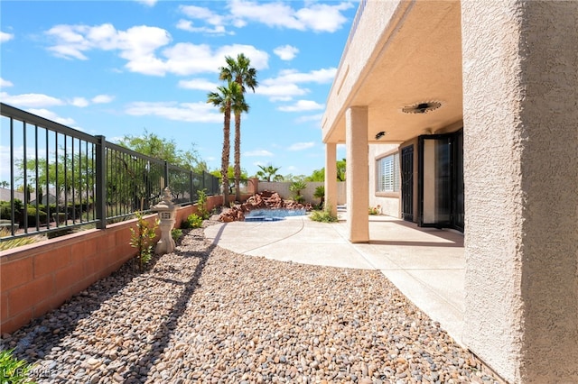 1016 Eaglewood Dr, Las Vegas, NV 89144 - fenced backyard with a patio