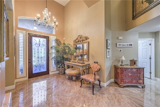 56 Ancient Hills Ln, Henderson, NV 89074 - entrance foyer featuring a high ceiling, marble tiled floors, and a chandelier