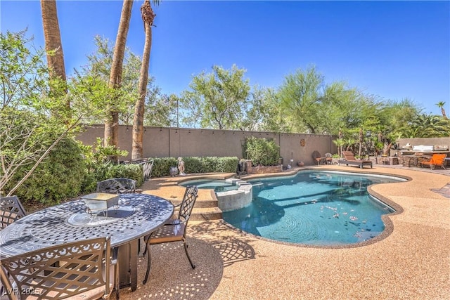 56 Ancient Hills Ln, Henderson, NV 89074 - view of swimming pool with a patio area, a pool with connected hot tub, and a fenced backyard