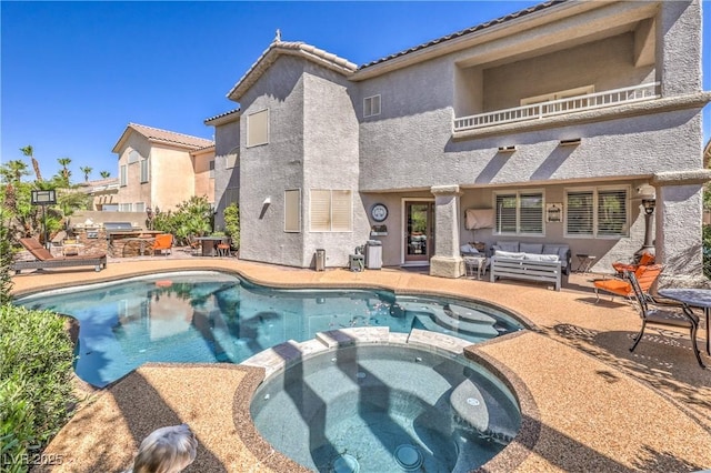56 Ancient Hills Ln, Henderson, NV 89074 - view of swimming pool featuring a pool with connected hot tub, outdoor lounge area, a patio, and grilling area