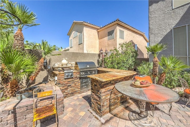 56 Ancient Hills Ln, Henderson, NV 89074 - view of patio / terrace with exterior kitchen
