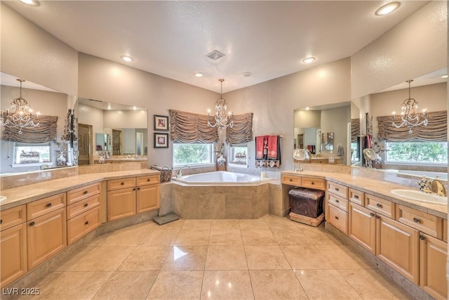 56 Ancient Hills Ln, Henderson, NV 89074 - full bathroom with a chandelier, plenty of natural light, a bath, and recessed lighting