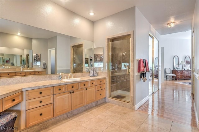 56 Ancient Hills Ln, Henderson, NV 89074 - full bathroom featuring vanity, tile patterned flooring, and a stall shower