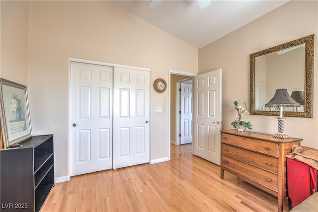 56 Ancient Hills Ln, Henderson, NV 89074 - bedroom featuring light wood-type flooring, vaulted ceiling, and a closet