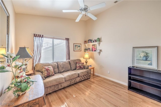 56 Ancient Hills Ln, Henderson, NV 89074 - living room featuring wood finished floors, ceiling fan, and vaulted ceiling