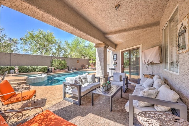 56 Ancient Hills Ln, Henderson, NV 89074 - fenced backyard featuring a pool with connected hot tub, outdoor lounge area, and a patio