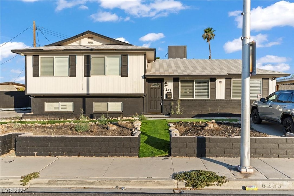 6233 Elton Ave, Las Vegas, NV 89107 - split level home featuring brick siding