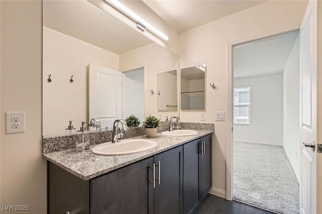 2670 Mango Light Ave, North Las Vegas, NV 89086 - full bathroom featuring double vanity and wood finished floors