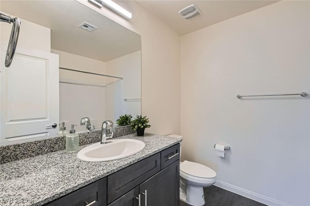 2670 Mango Light Ave, North Las Vegas, NV 89086 - full bathroom featuring vanity, a shower, and wood finished floors