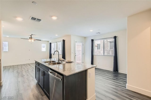 2670 Mango Light Ave, North Las Vegas, NV 89086 - kitchen with dishwasher, light wood-type flooring, an island with sink, a ceiling fan, and recessed lighting
