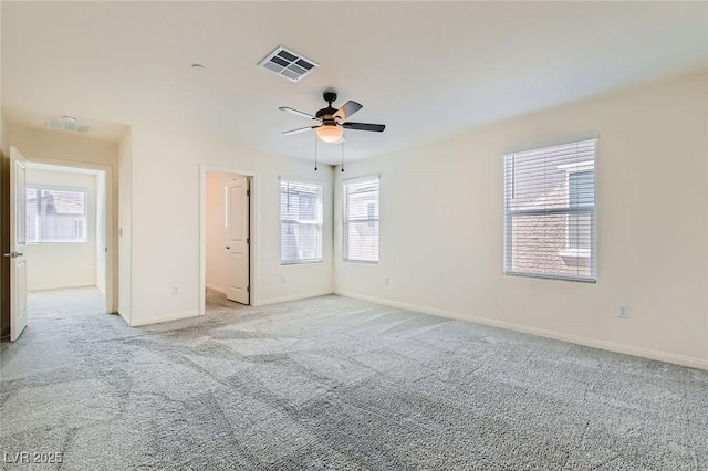 2670 Mango Light Ave, North Las Vegas, NV 89086 - unfurnished bedroom with light carpet and a ceiling fan