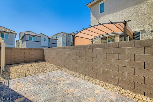 2670 Mango Light Ave, North Las Vegas, NV 89086 - fenced backyard featuring a residential view and a patio area